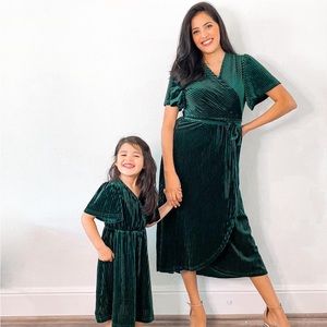 Mommy & Me green velvet dresses.